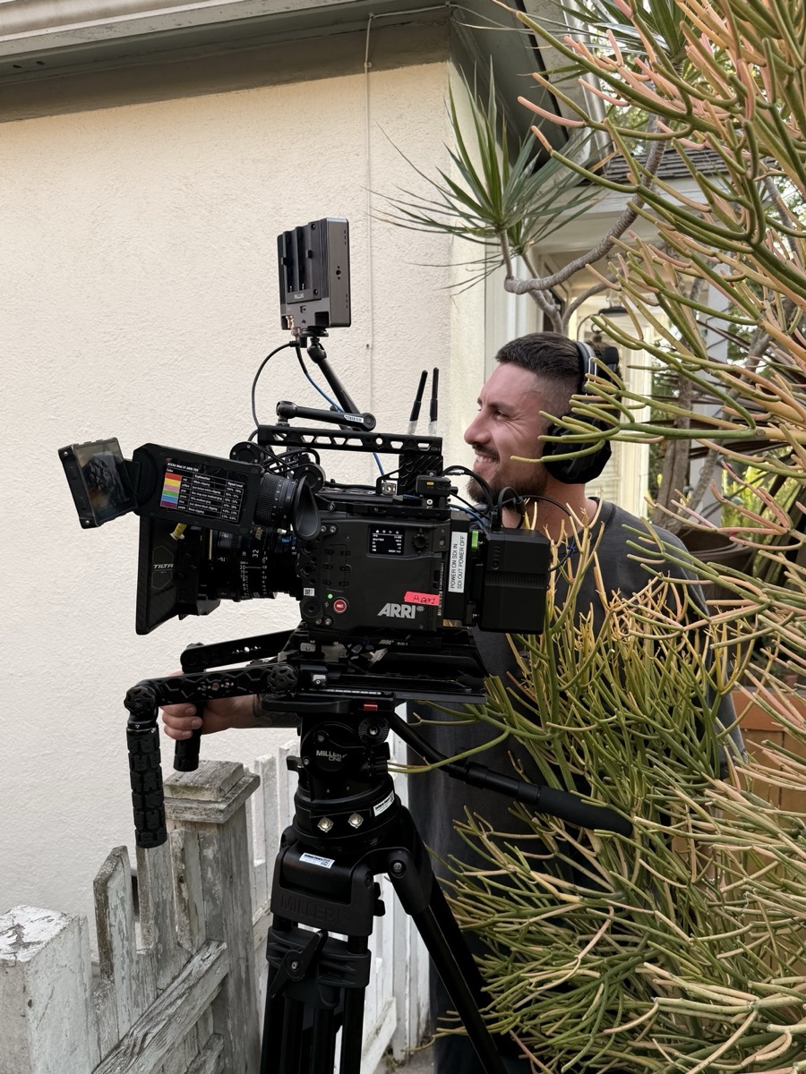 ARRI camera set up outdoors beside a house